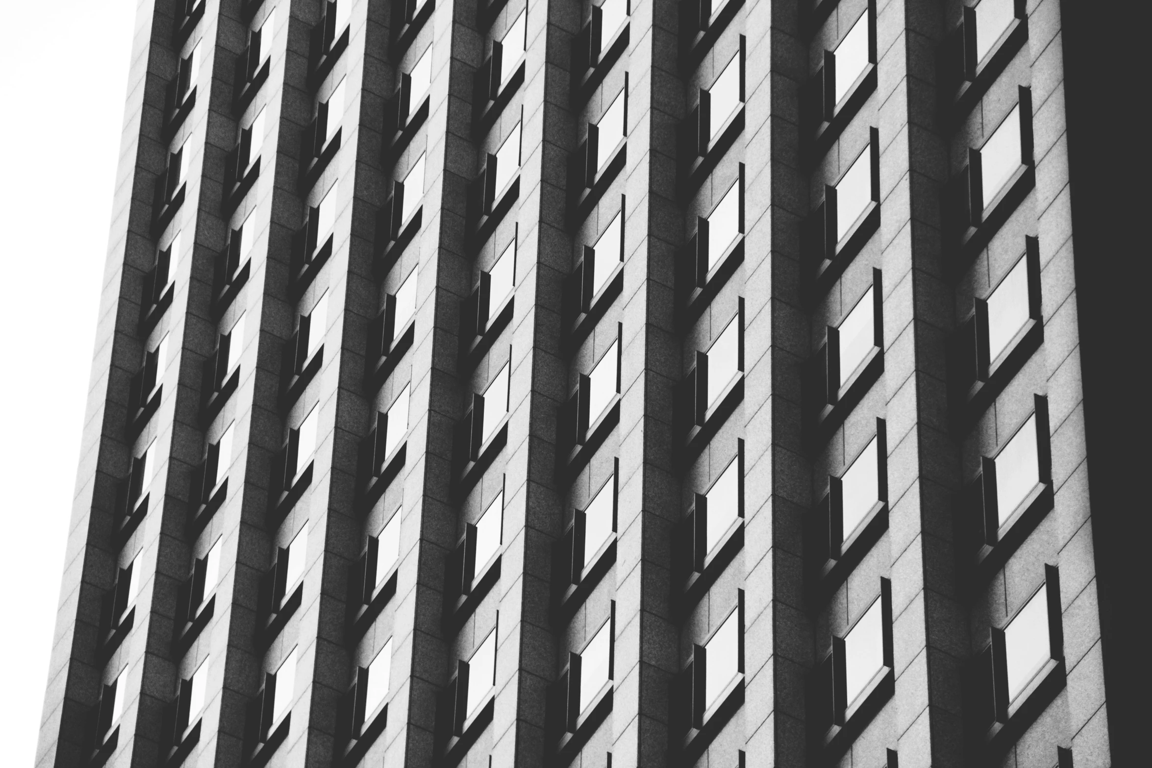 a tall building in front of a white sky