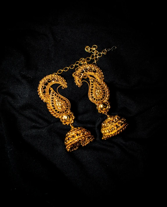 some golden items on a black cloth