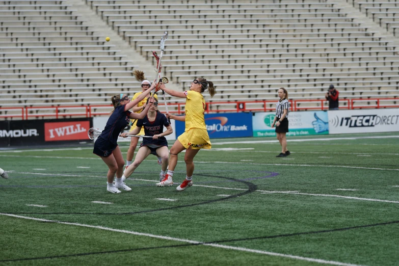 a group of girls playing a game of tennis