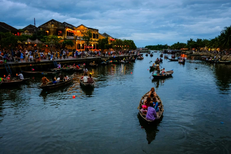 boats floating on the river with buildings around them