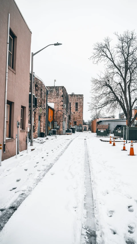 two buildings are visible behind an intersection in winter