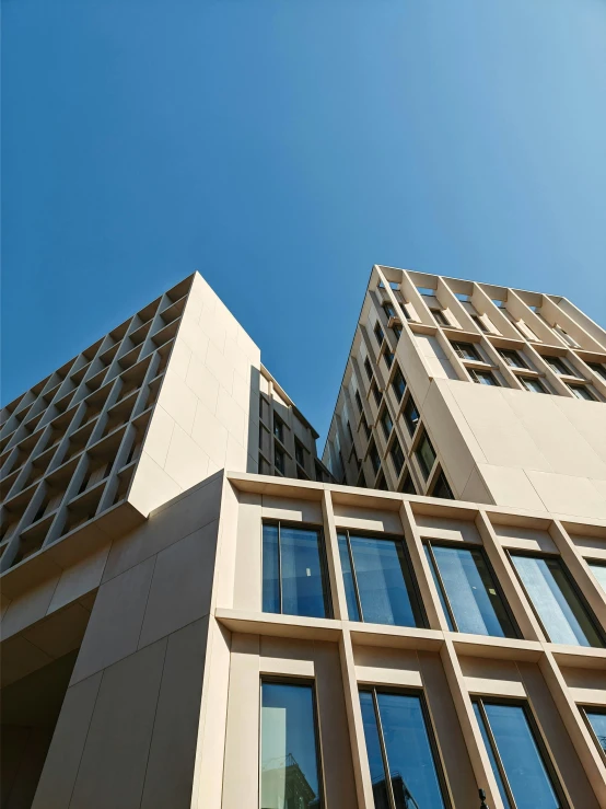 looking up at an upward view of skyscrs in a city