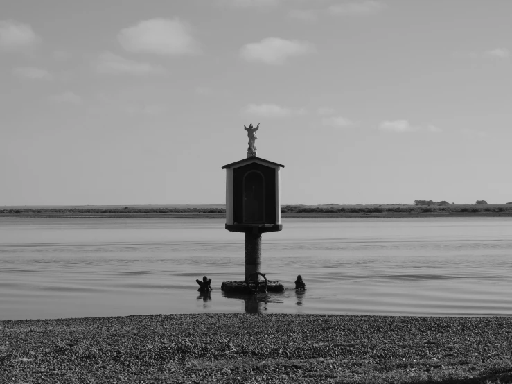 a black and white po of the lake side clock tower