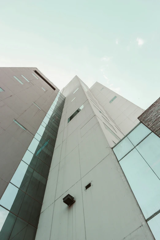 a tall brick building with a sky background