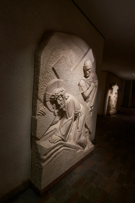 a stone carving with an image of jesus