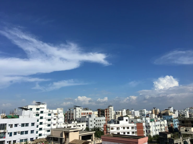 the view from the top of a high rise building in a city