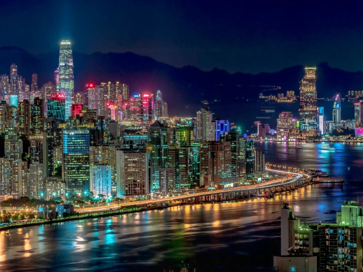 a view of a large city at night with lights shining on the buildings