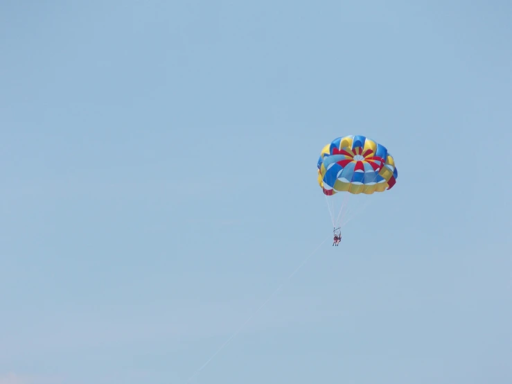 two parachutes flying high in the sky