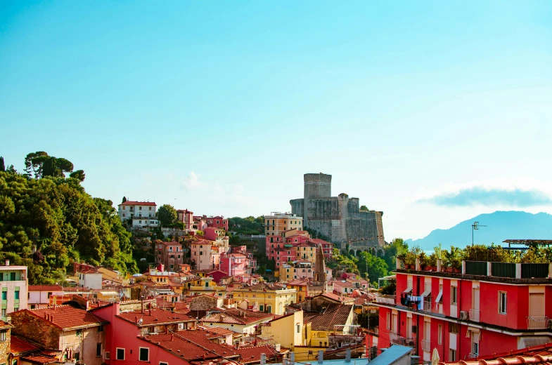 buildings with rooftops and mountains in the background