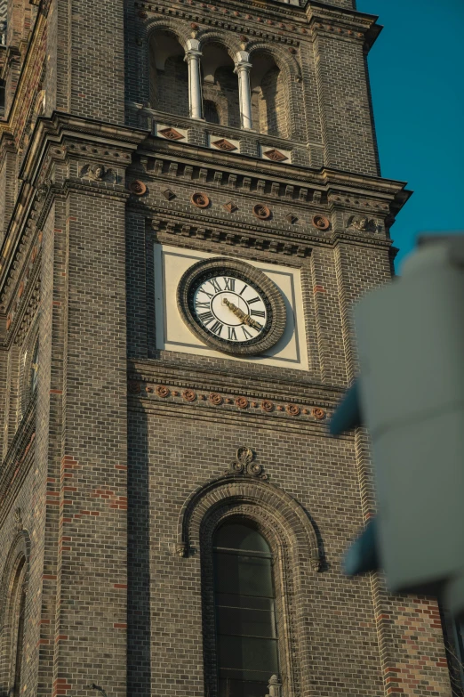 there is a very tall brick clock tower