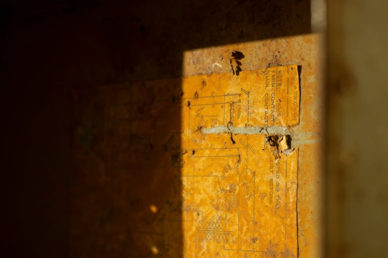 the wall is yellow with the paint and the nails peeling off