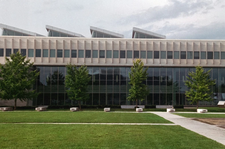 the courtyard outside of a building with some grass