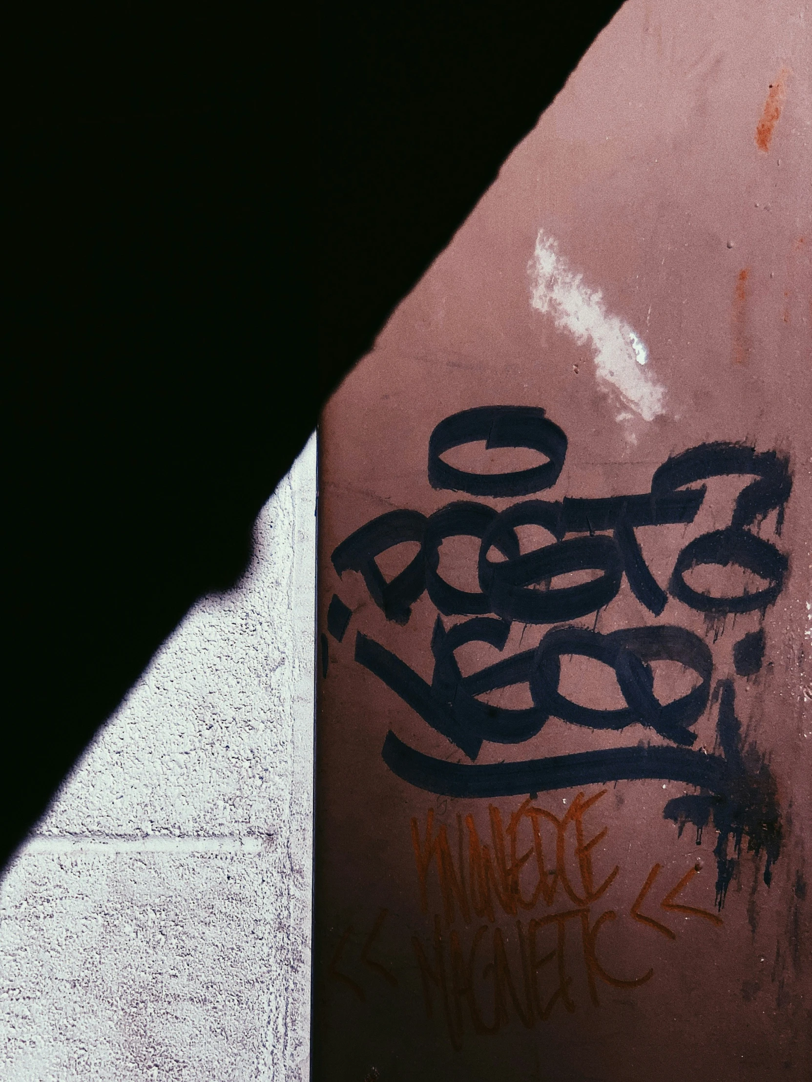 a person is riding a skateboard near a wall