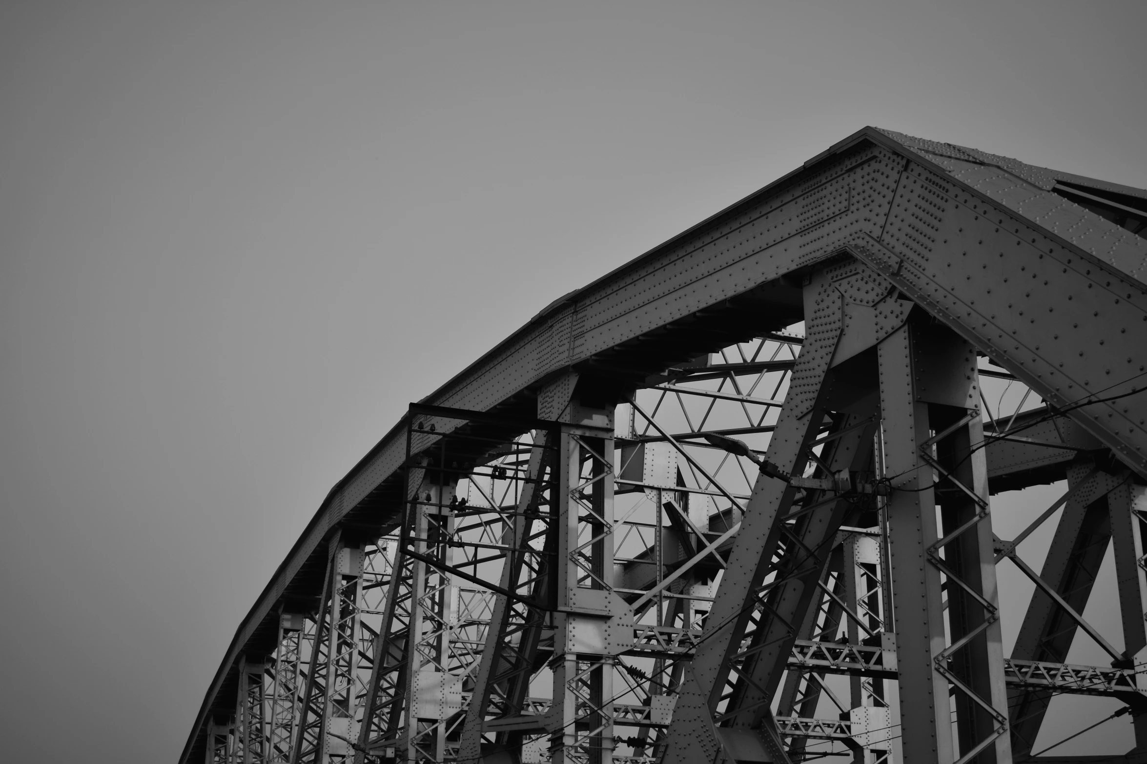 the underside of an old steel bridge