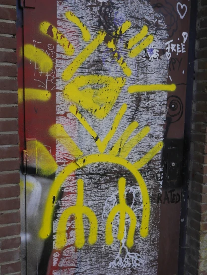 a graffiti drawing on a door and on the side