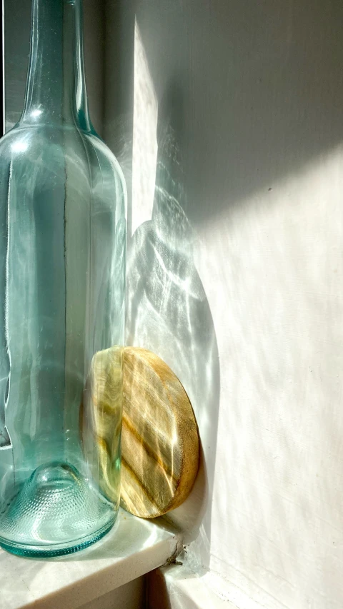 a blue bottle sitting on top of a table