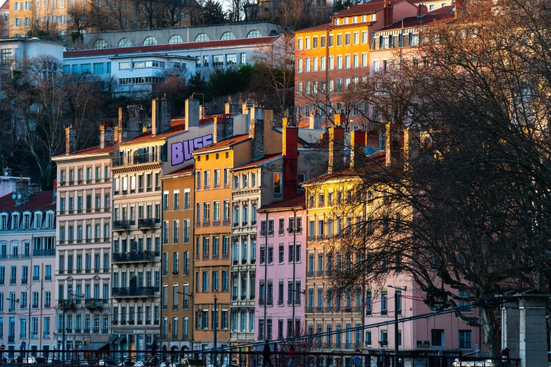 an image of many colorful building on a hill