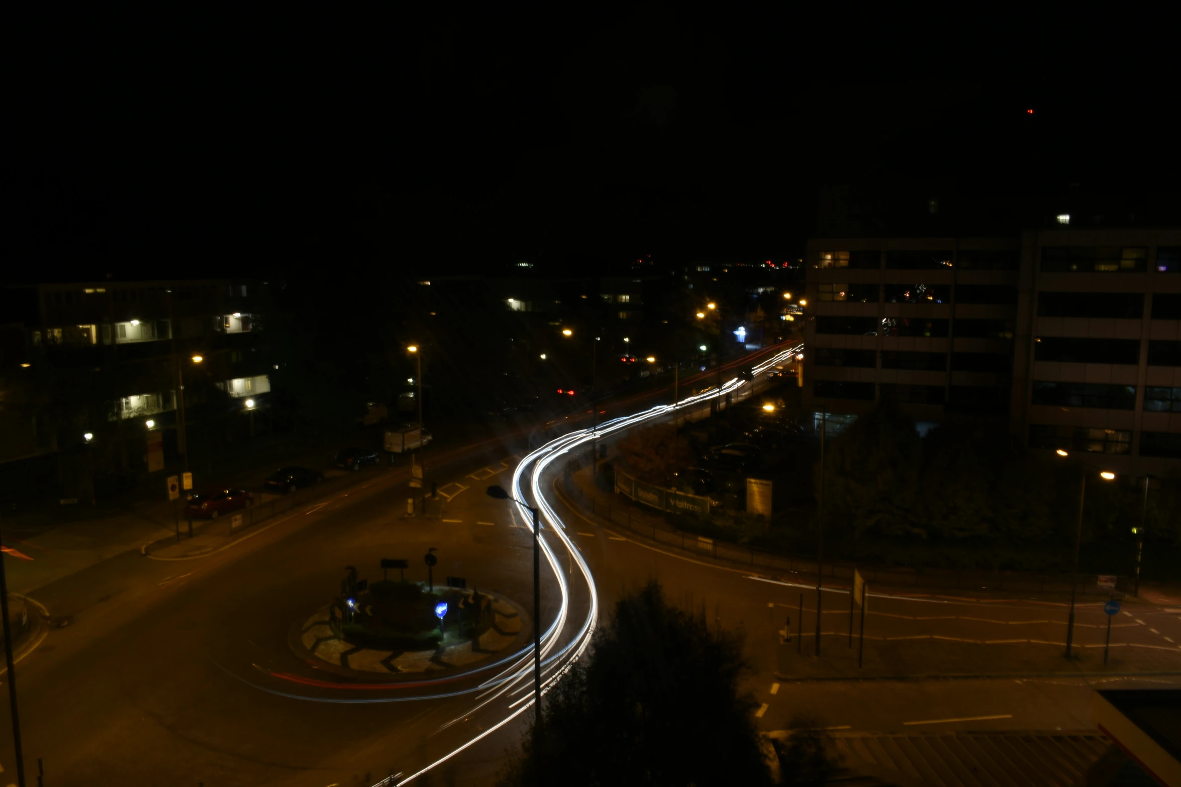 an aerial view of a street at night