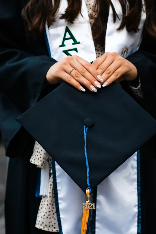 a graduating student in her cap and gown