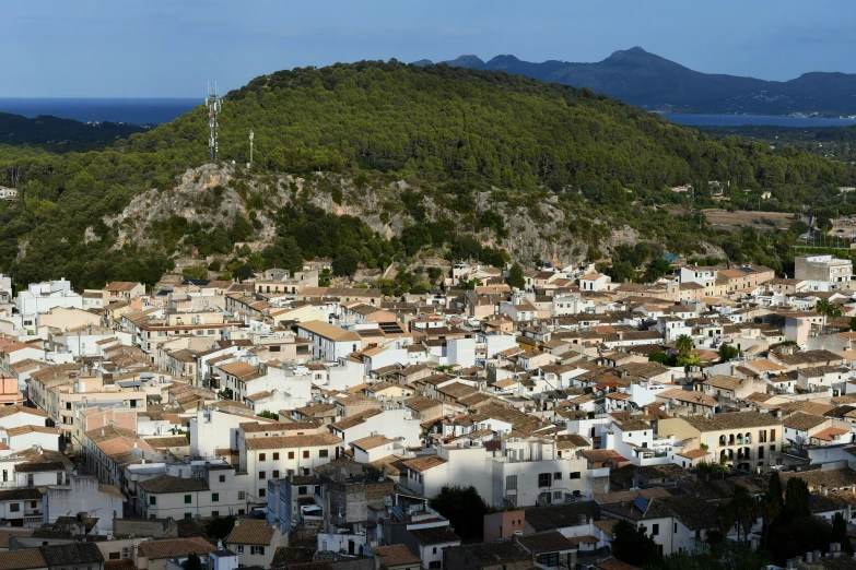 an overview view of several cities and the hills surrounding it