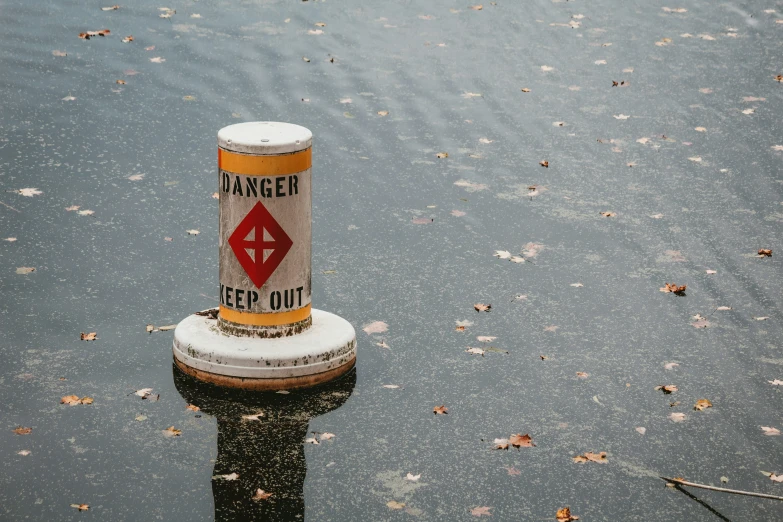 there is a sign that says danger be out in the water