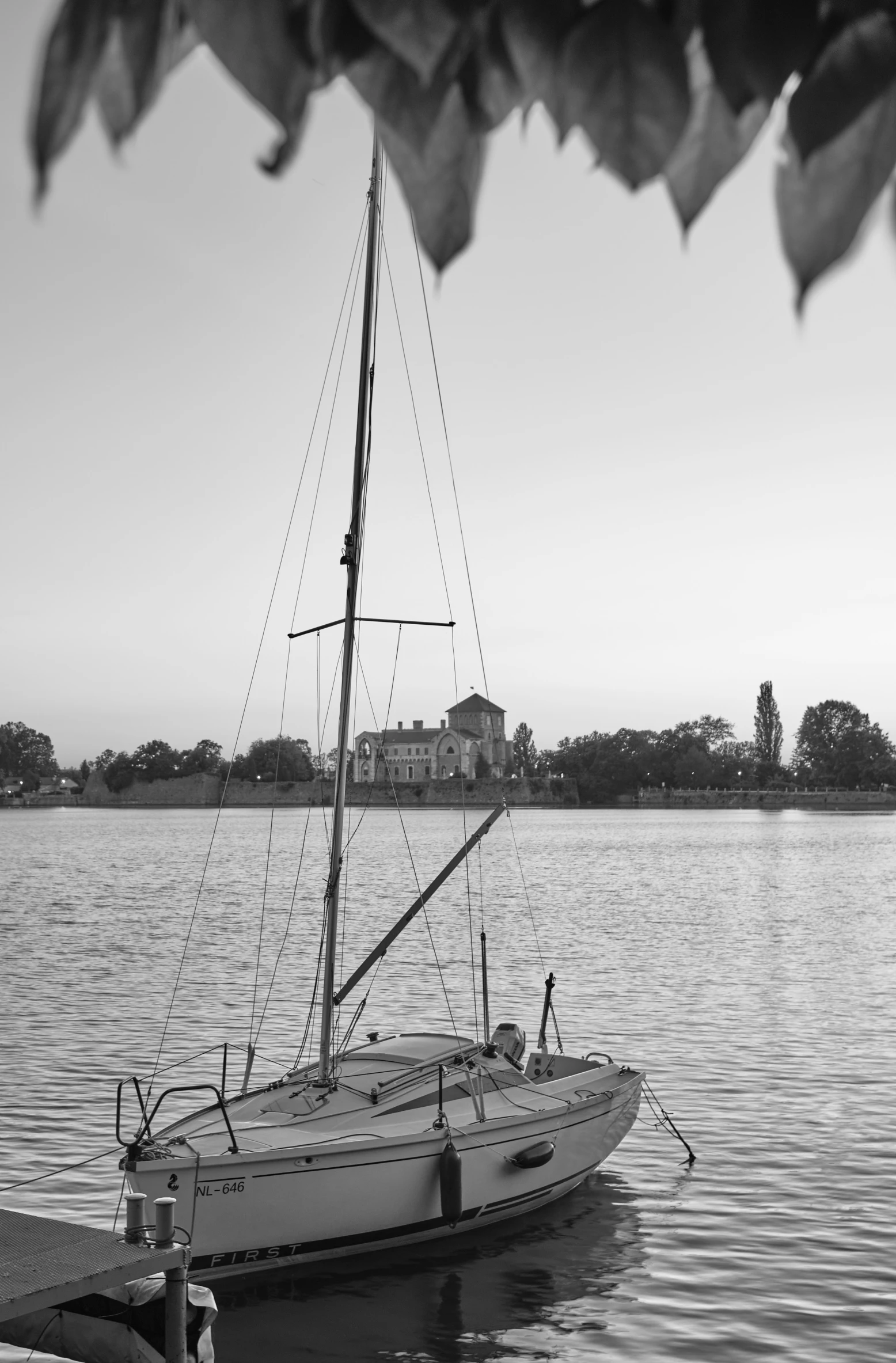 a black and white po of a sailboat