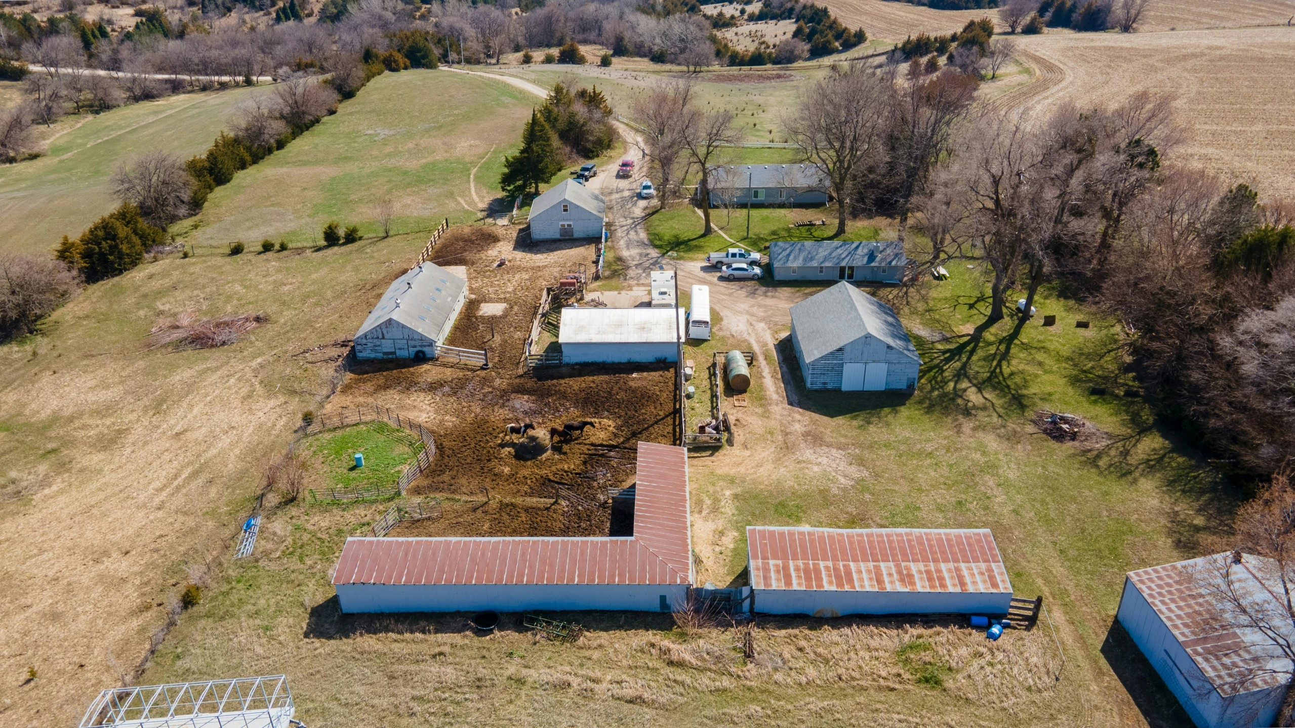 a po of an aerial view of a farm with several barns and a barn