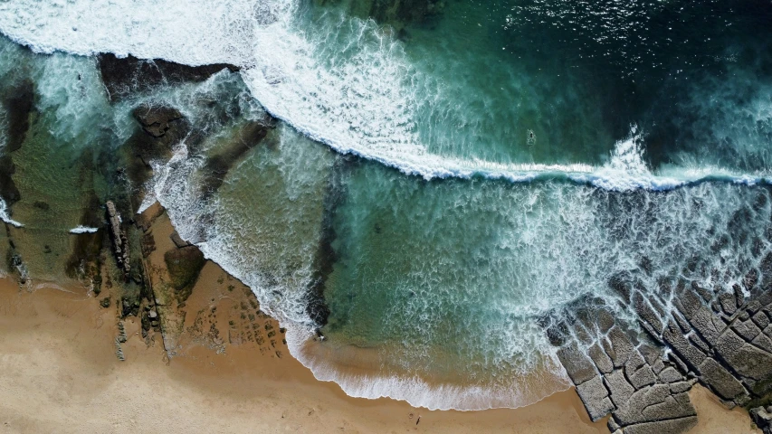 the sea and shore line are in this aerial po