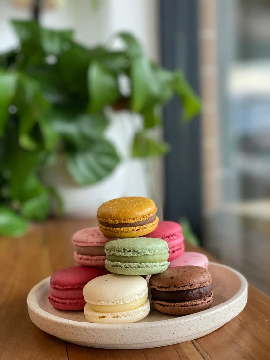 there are a bunch of macaroons sitting on a tray