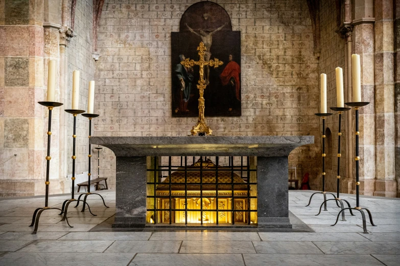 a chapel with a religious altar and cross next to it