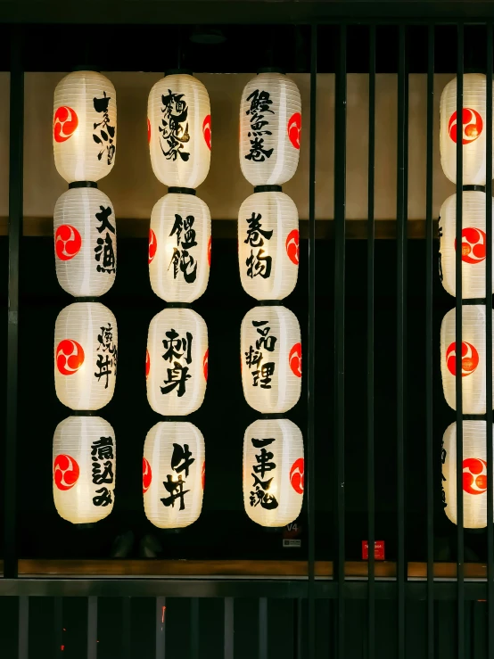 japanese paper lanterns in a building with asian writing