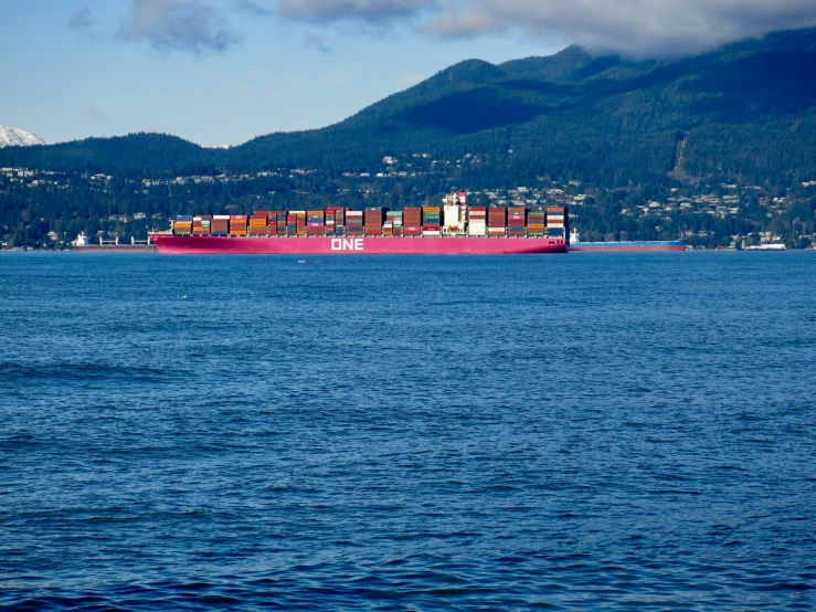 a large boat with a big load out on the water