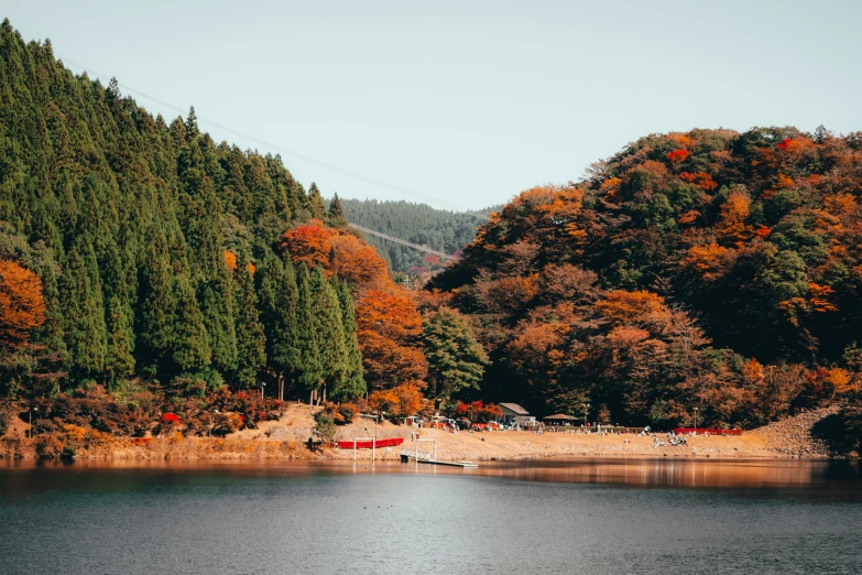 the boat is floating on the water near the shore