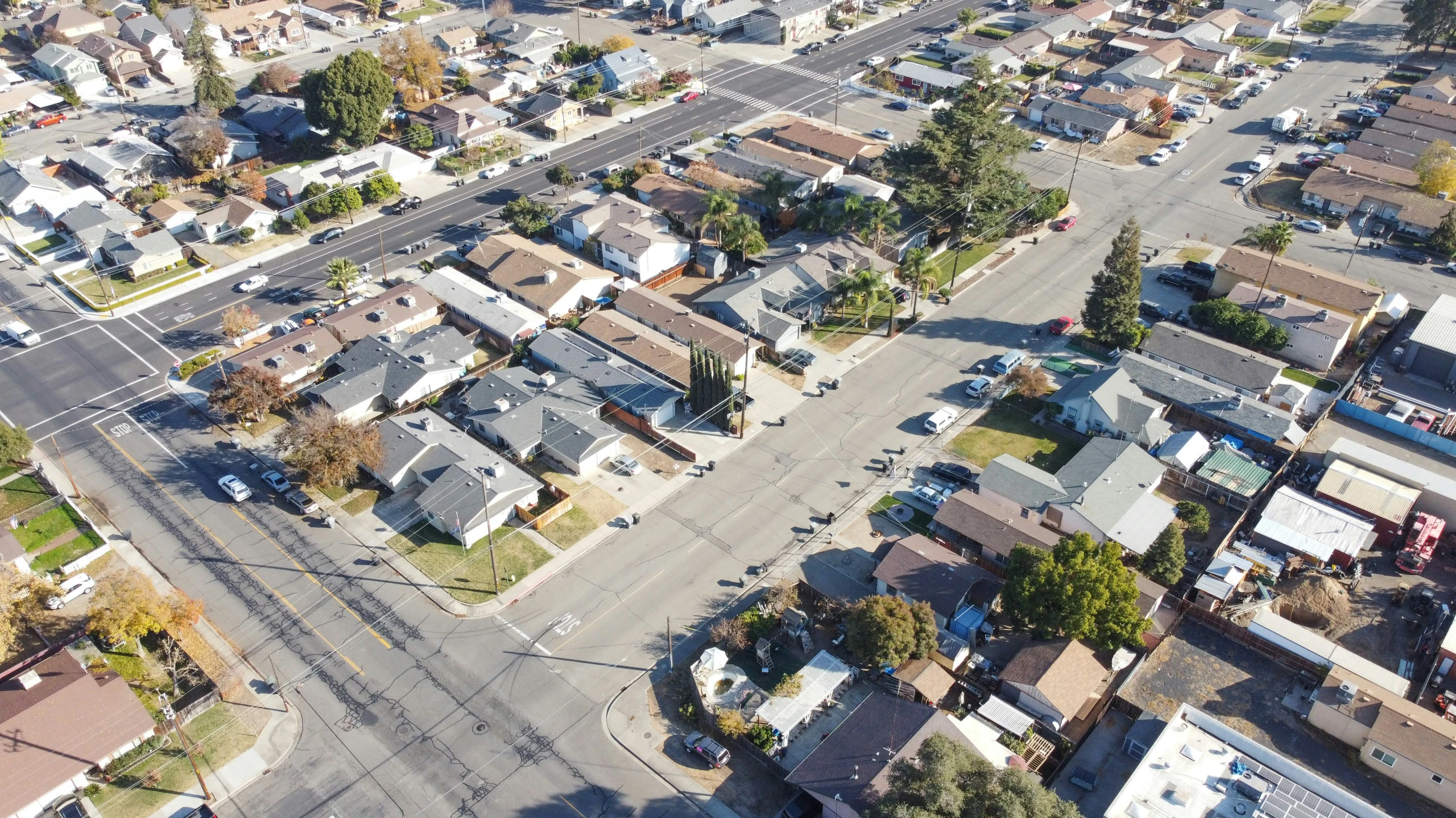 an aerial view of a city, including houses and streets