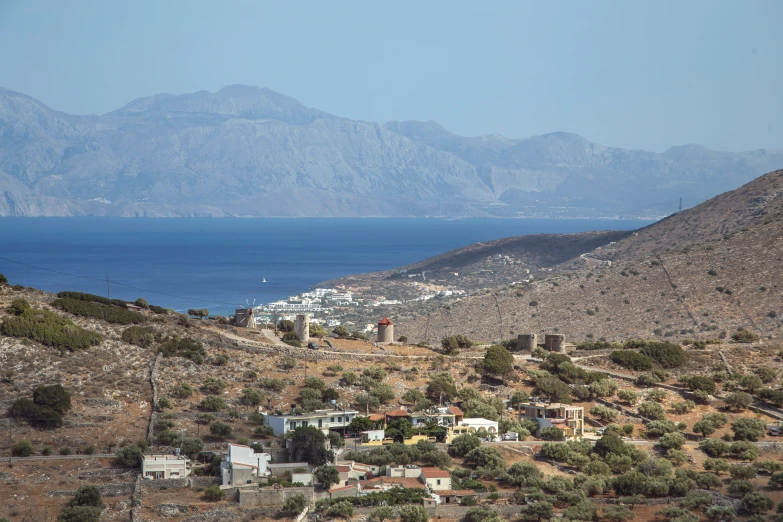 a hill top with a body of water below it