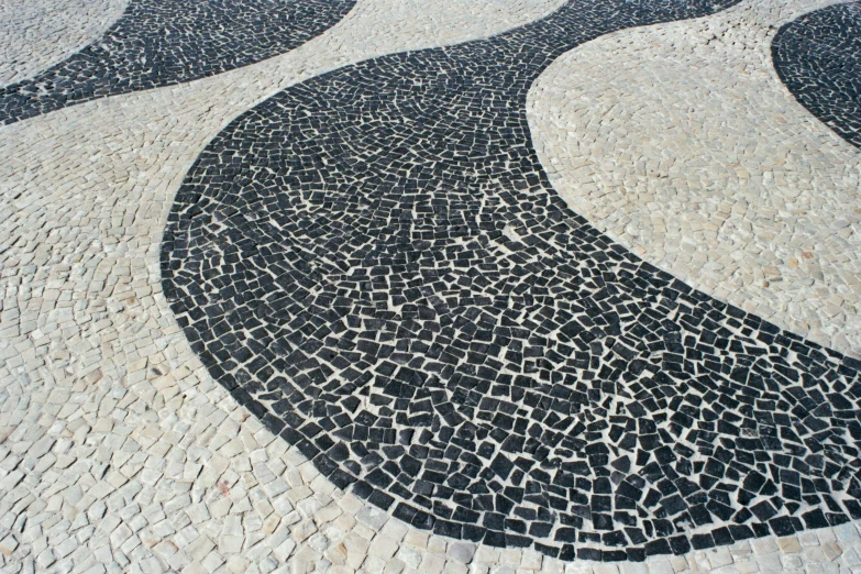 decorative mosaic tile on walkway with water flowing down it