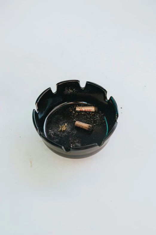 the small ashtray is ready to be used with an alcohol or tea