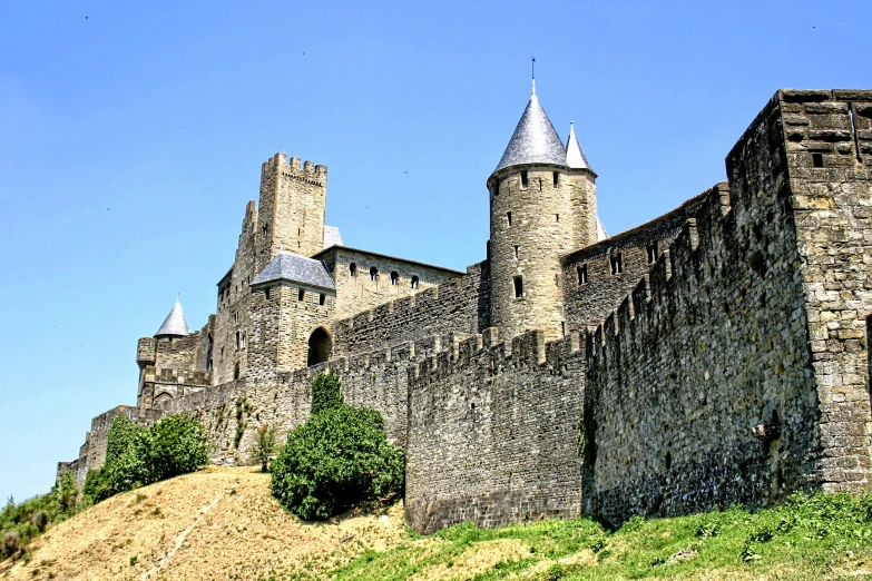 there is an old castle on top of a hill