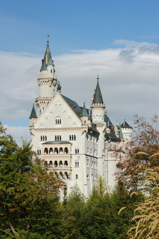 an ornate castle is shown on a sunny day