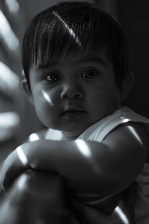 black and white po of young  looking up at camera