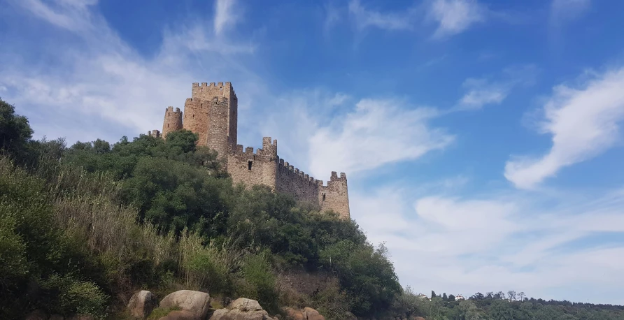 a castle on top of a hill in the middle of nowhere