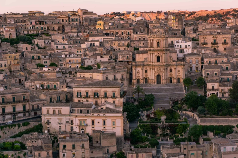 an overview view of an old city at sunrise