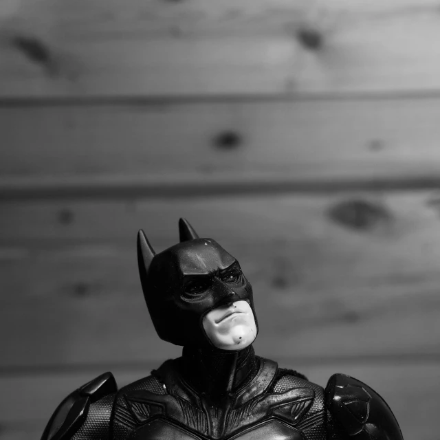 a close - up s of batman action figure in black and white