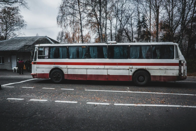 a public transit bus parked at a stop