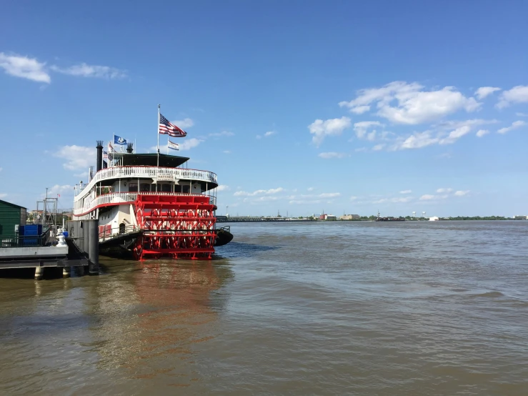 a large ferry boat in the water and a dock