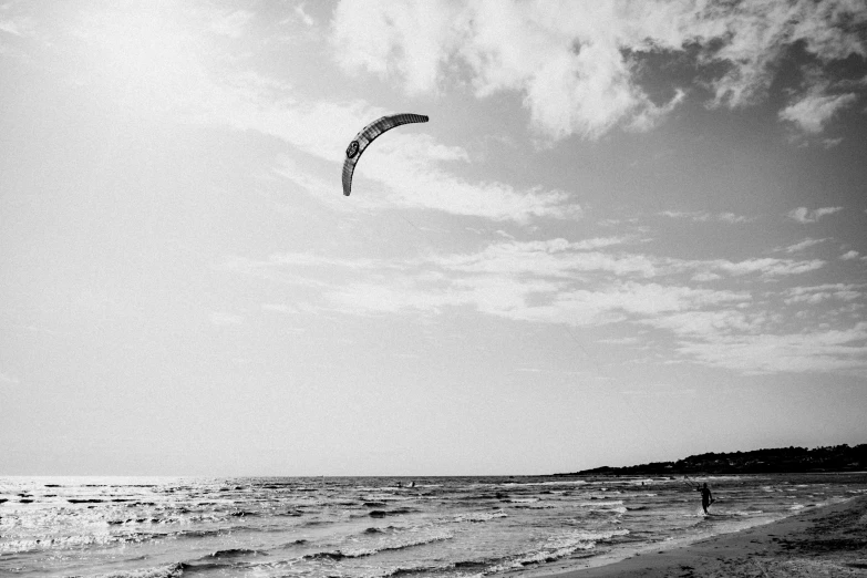 a person that is windsurfing on a large body of water