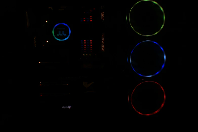 a computer screen with three round blue lights on it