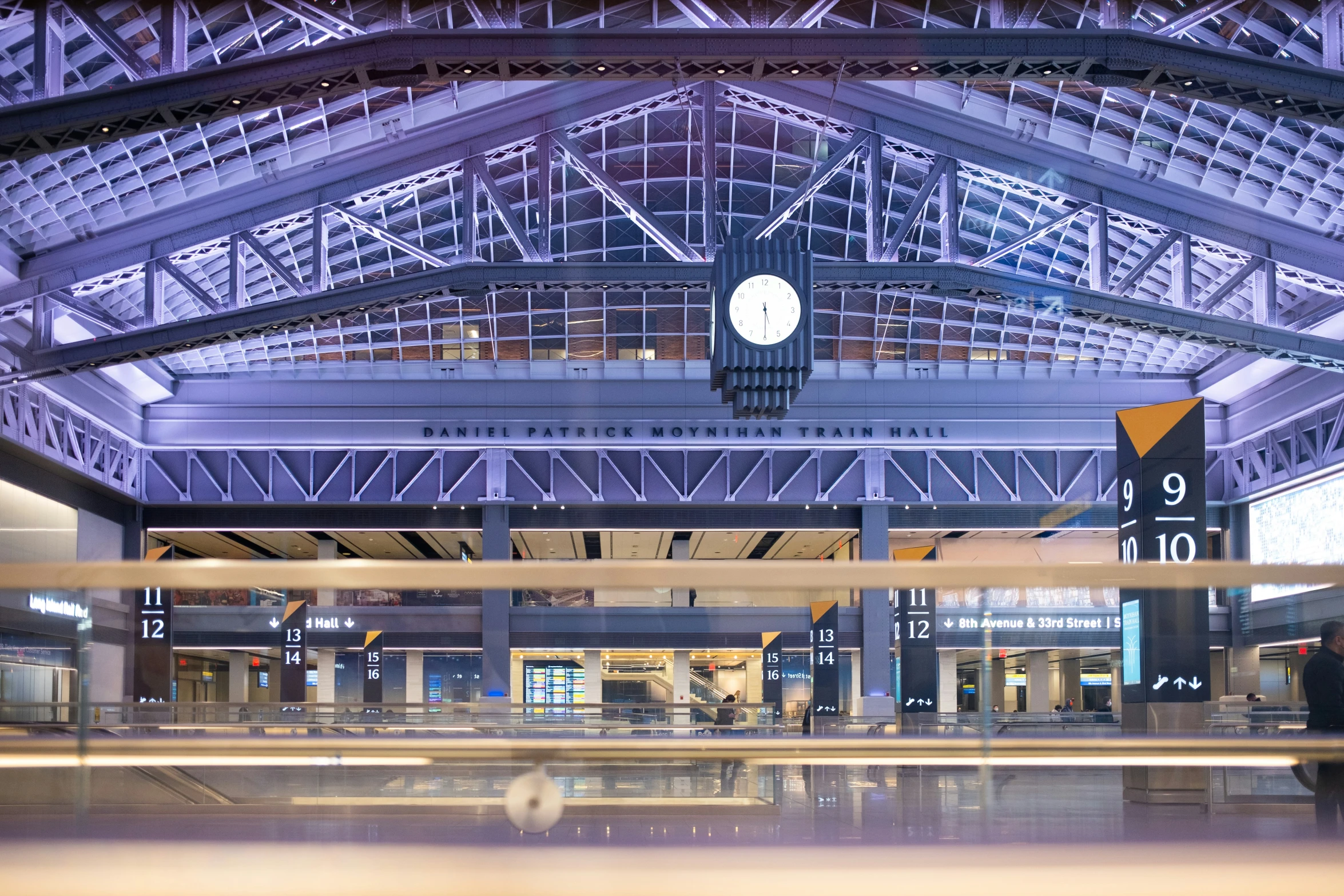 a clock on the inside of a train station