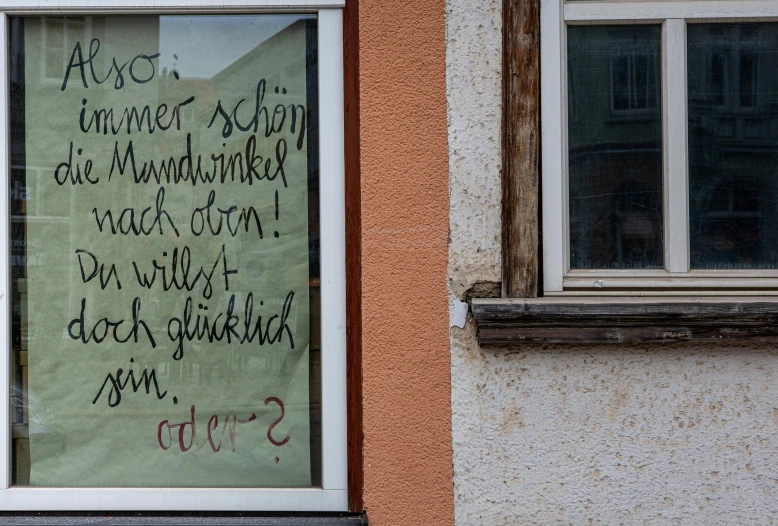 a message on the glass behind a window