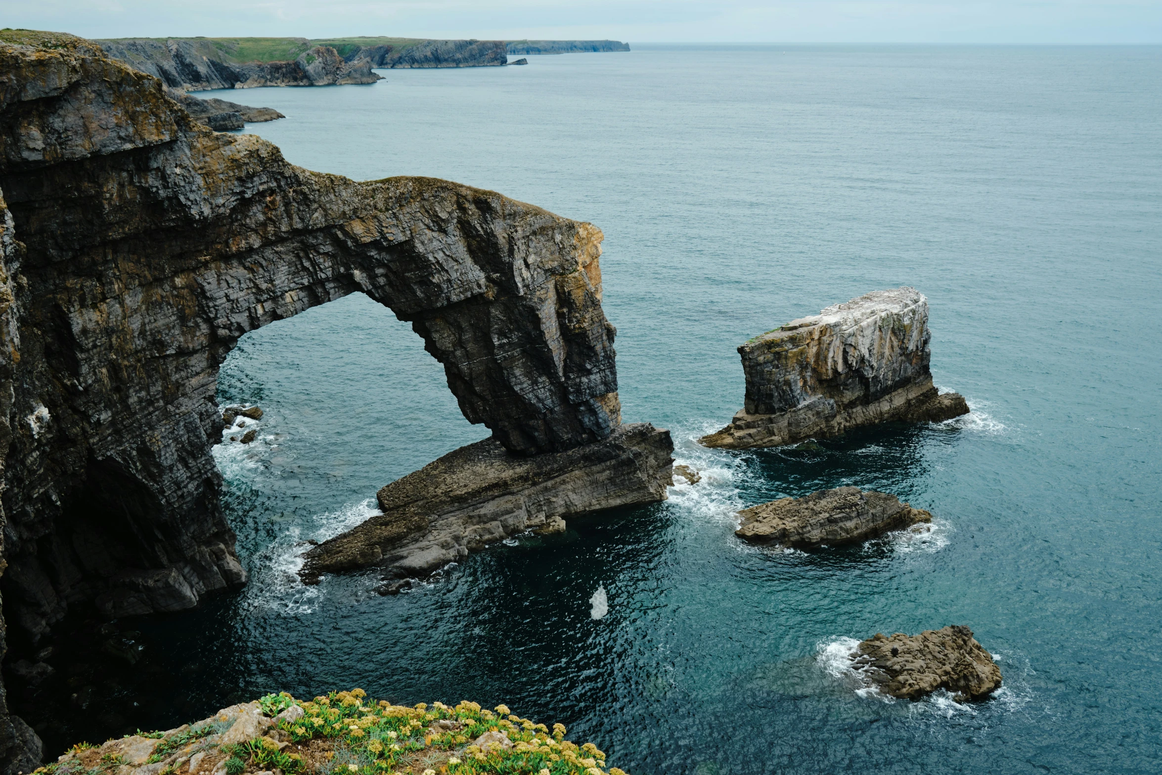 a cliff that is very close to the water